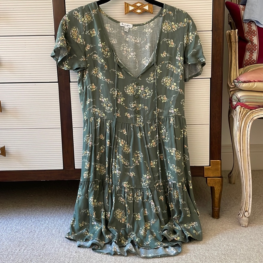 Worn a couple of times; has tie at front